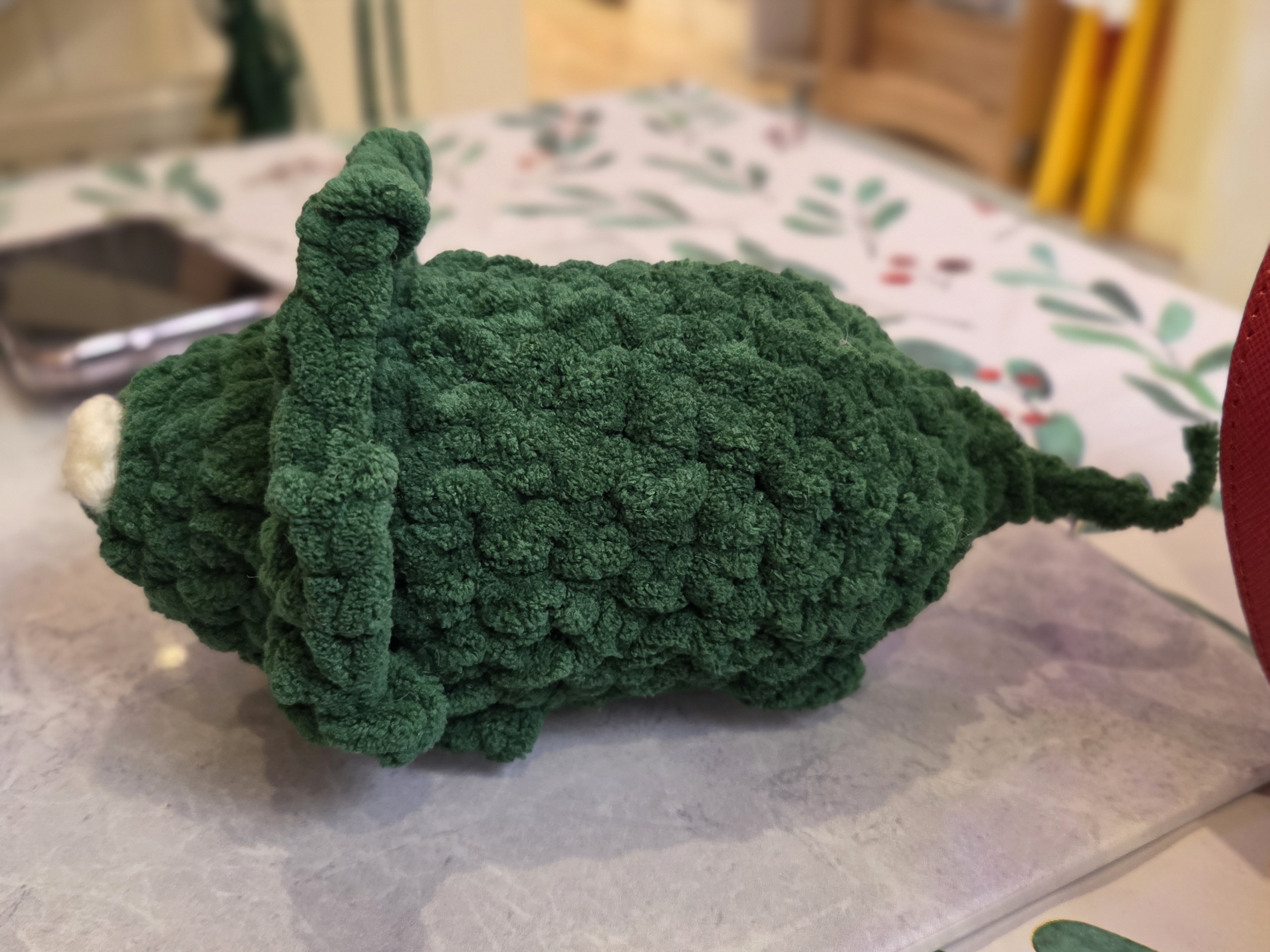 Green crochet dinosaur image 2: side angle